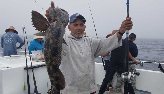 Sergio sportfishing captain with a lingcod