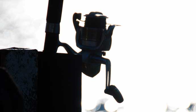 A spinning reel in a holder
