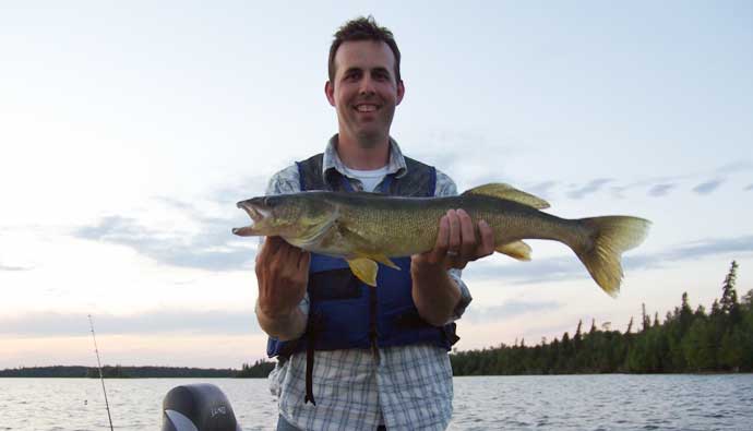 man catches walleye with the best walleye lures
