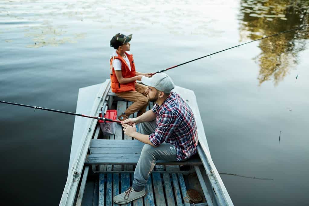 two people waiting to catch fish