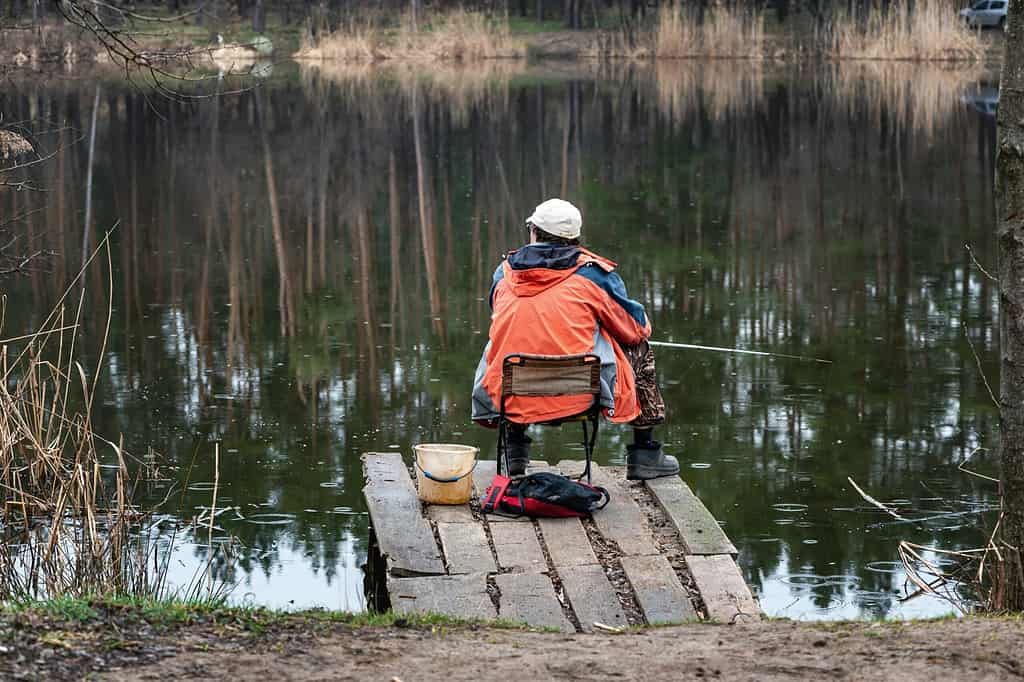 man fishing from a dock
